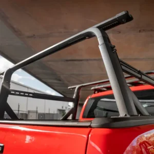 EGR adjustable ladder rack installed on a red Ford Ranger with RollTrac cover.