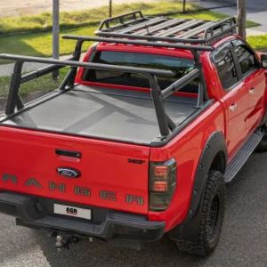 Red Ford Ranger fitted with EGR RollTrac roller cover and dual adjustable ladder racks.